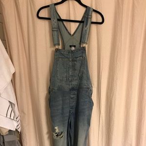 Women’s full length ripped overalls.